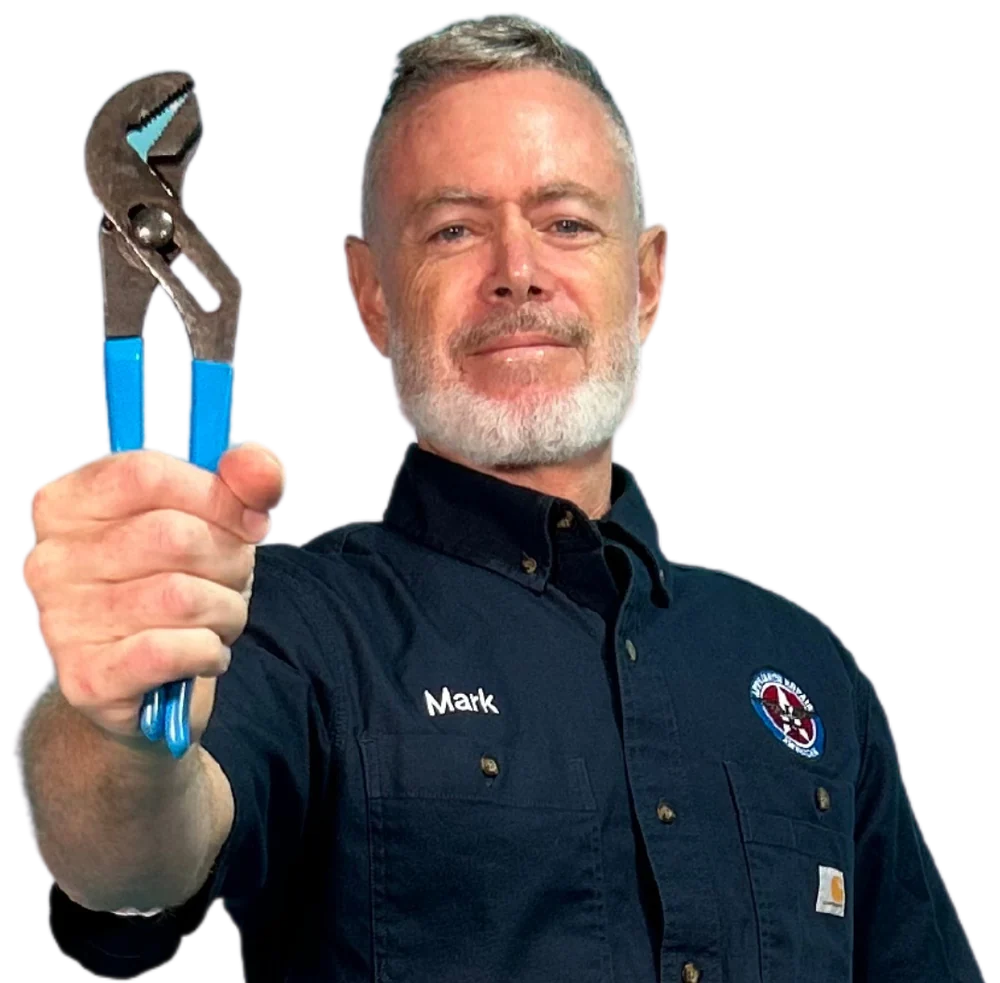Mark Oliver holding blue-handled pliers, Appliance Repair American
