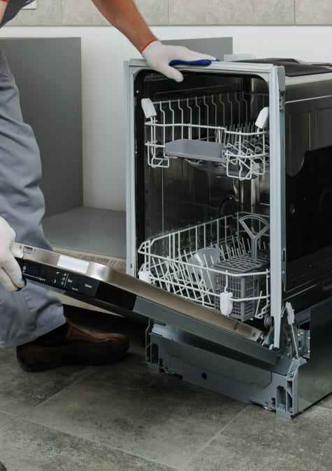 Dishwasher beside protective material during installation work