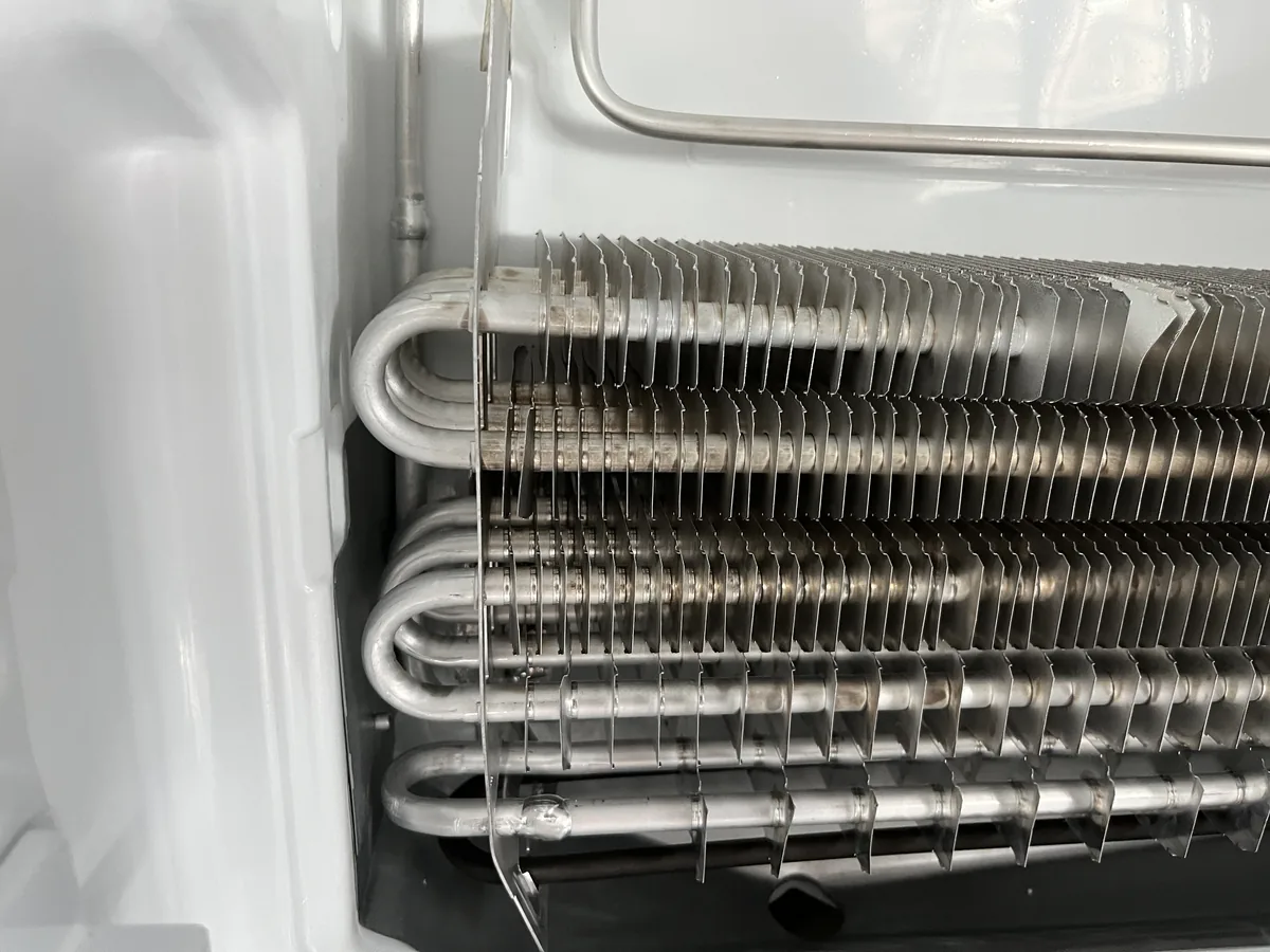 Exposed refrigerator evaporator coils and tubing